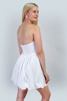 This strapless mini dress features a pink ribbon detail at the front and a fitted waist, providing a flattering silhouette. The bubble skirt hemline adds a touch of playfulness. With a center back zipper for easy wear and made of a self material blend for added comfort. Size & Fit Model Measurements (Model is wearing Size S) Bust: 33" Waist: 27" Hips: 37" Height: 5'6" Small Business Boutique, Business Boutique, Strapless Tube Dress, Bubble Skirt, The Bubble, Shop Small Business, Strapless Mini Dress, Pink Mini Dresses, Tube Dress