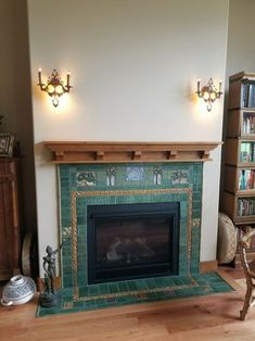 a living room with a fire place in the center and bookshelves on either side