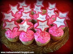 cupcakes with pink frosting and stars on them