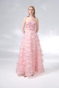 This dress is the perfect choice for a formal event. The dress features an elegant strapless design and is made of high-quality organza fabric. Its floor length adds a touch of sophistication to any occasion. Make a statement with this beautiful dress. *Product length is measured from the shoulder to the hem. Formal Organza Evening Dress With Ruffles, Elegant Evening Organza Ball Gown, Glamorous Strapless Prom Ball Gown, Organza Ball Gown With Sweetheart Neckline For Prom, Elegant Organza Gown For Prom, Elegant Organza Prom Gown, Strapless Ball Gown With Ruched Bodice For Evening, Strapless Prom Ball Gown With Ruched Bodice, Floor-length Organza Evening Dress For Gala