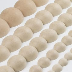 a group of white balls sitting next to each other