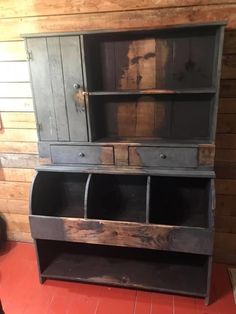 an old wooden cabinet with two open doors on the front and one closed door on the back