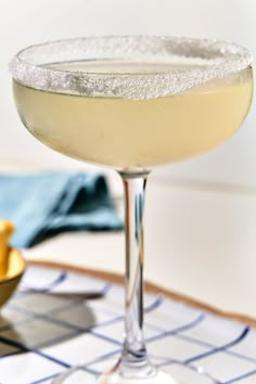 a close up of a drink in a glass on a table