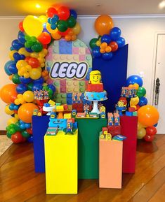 a lego themed birthday party with balloons and decorations