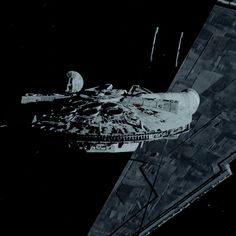 an aerial view of a star wars ship in the dark