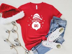 "Santa's Favorite Ho Shirt, Christmas T-Shirt, Santa Shirt, Funny Christmas Santa Shirt, Santa Favorite Hoe T-shirt, Christmas Tee, Santa Tee ☀️☀️☀️☀️☀️ Everything in our shop is hand crafted and made to order. If you want different color or size contact me! If you would like something custom made to fit your personal style please message me and I will do everything to get you that something special. ---How To Order--- ⭐️Please, check and review all photos ⭐️Choose your t-shirt size and color ⭐️ Horse Trainer Gifts, Lv Shirt, Santas Favorite Ho, Equestrian Shirt, Santa Tee, Valentine Gifts For Kids, Farmer Shirt, Santa Shirt, Santa Shirts