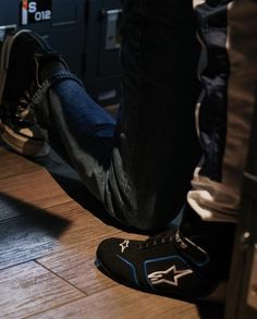 a person standing on top of a wooden floor