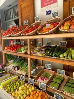 an assortment of fruits and vegetables on display