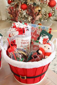 a basket filled with christmas items on top of a table