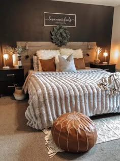 a bedroom with a large bed and brown accents