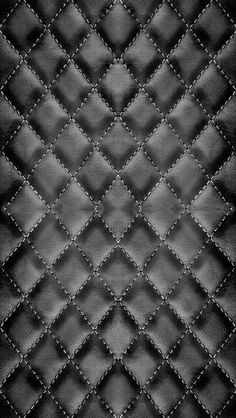 black and white photo of an upholstered leather background