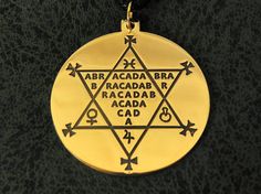 a gold medallion with the names of different people on it