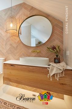 a bathroom with a sink, mirror and toilet paper roll on the counter next to it