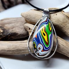 This Has So Many Bright Colors! This Fordite Came From The Kenworth Truck Factory. Normally I Form And Polish All Of My Fordite, But This Is The First One That I Purchased From A Seller. I Created The Sterling Silver Setting And Gave It A Darker Finish To Soften The Look Of The Silver. It Comes With A 20 Inch Leather Cord Necklace With A Sterling Silver Clasp. I Also Added A Picture Of What Fordite Looks Like When I Purchase It. What Is Fordite? It's Overspray From Painting The Trucks. When The Leather Cord Necklace, Kenworth Trucks, Leather Corded Necklace, Cord Necklace, Leather Cord, Necklace Set, Bright Colors, Silver Color, Trucks