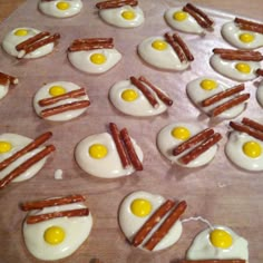 bacon and eggs are arranged on top of each other in the shape of sausages