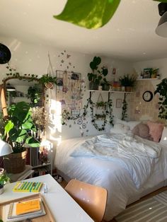 a bedroom with lots of plants on the wall