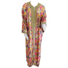 Elegant Moroccan caftan metallic silk floral brocade, circa 1970s. This light summery caftan is crafted in Morocco and tailored for a relaxed fit, features a traditional neckline, embellished sleeves and vented sides. This long maxi dress kaftan is embroidered and embellished entirely by hand. One of a kind evening Moroccan Middle Eastern gown. In Morocco, fashion preserves its traditional style inherited from great civilizations that found their way to Northwest Africa, such as the Ottomans and Art Nouveau Fashion, Morocco Fashion, Moroccan Fabric, Bohemian Fabric, Moroccan Kaftan, Dress Kaftan, Moroccan Fashion, Moroccan Wedding, Moroccan Caftan