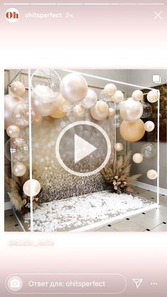 a room with balloons and other decorations on the wall, as well as a video player