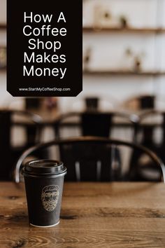 a coffee cup sitting on top of a wooden table with the words how a coffee shop makes money