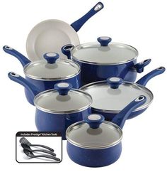 a set of blue pots and pans with lids