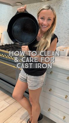 a woman standing in front of an oven holding a cast iron skillet with the words how to clean & care for cast iron