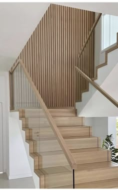 the stairs are made of wood and have handrails