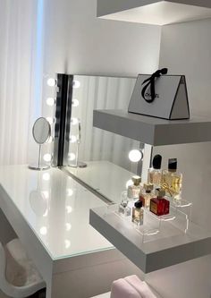 a vanity with lights and bottles on it