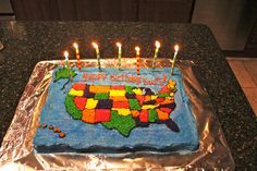 a birthday cake with candles in the shape of the united states