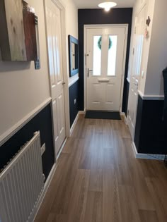 Hall in dark navy and white. Loving the result. Navy And White Hallway Ideas, Hall Dado Rail Hallways, Hall With Dado Rail, Painted Dado Rail Hallway, Dado Rail Decorating Ideas, Dark Hallway Paint Ideas, Black Panelling Hallway, Hallway With Dado Rail, Hallway Dado Rail