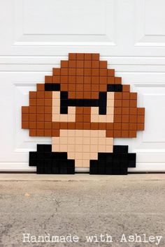 an image of a pixel art piece made out of legos on the side of a garage door