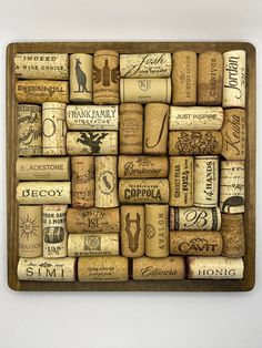 many different types of wine corks are stacked on top of each other in this image