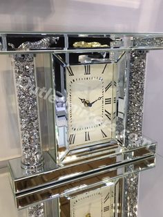 a large crystal clock sitting on top of a table