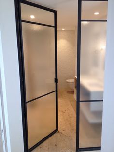 an open door leading to a bathroom with a toilet