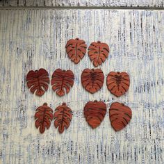 six wooden leaves arranged in the shape of hearts