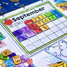 a close up of a calendar on a table with numbers and letters around it that spell out the month