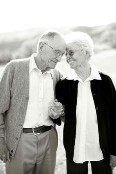 an older couple standing next to each other