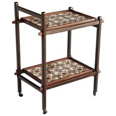 two tiered wooden tray with tile on the top and bottom, sitting on wheels