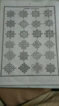 an old cross stitch pattern on a piece of white paper with black trimmings