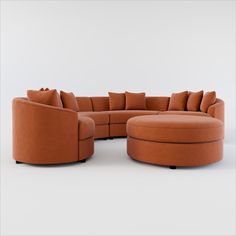 an orange sectional couch and ottoman with pillows on the bottom, in front of a white background