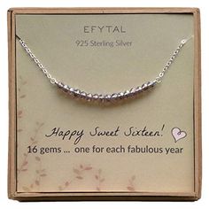 the happy sweet sixteen necklace is on display in a cardboard box with its card saying happy sweet sixteen, 16 gems for each fabulous year