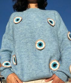 Unique Evil Eye Cardigan,Crochet Evil Eye Knit Women Sweater, Handmade Soft Knit Outfit,Gift kit for her,Jumper Y2k Top,Cozy Pullover This cardigan is a UNIQUE and one and only piece. It is handknitted with mixture of cotton and polyester yarn. (%70 Cotton, %30 Polyester) Evil Eye Pattern is hand crocheted and %100 baby cotton yarn is used. 100% Handmade, Free Shipping SIZE: One size fits for 36,38,40,42 // S,M,L,XL CARE: Washing instruction: gentle/hand washing can be done at max 30o Do not tum Casual Blue Crochet Patterns, Casual Blue Crochet Knitting Pattern, Blue Crochet Knit Knitting Pattern, Casual Acrylic Crochet Knitting Pattern, Blue Crochet Top For Winter, Unisex Gift Ideas, Crochet Evil Eye, Jumper Crochet, Unique Cardigan