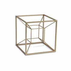 a golden metal cube on a white background