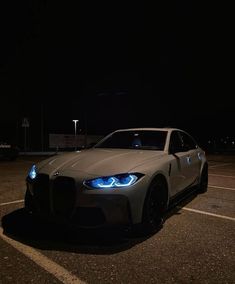 a car parked in a parking lot at night