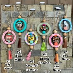 a bunch of items that are hanging on a brick wall with the words mama, bright, colorful teacher and pink nurse