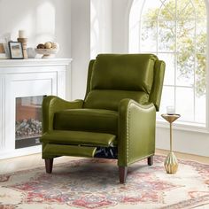 a green recliner chair sitting in front of a fireplace