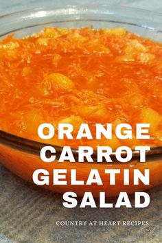 an orange carrot gelatin in a bowl with the words orange carrot gelatin salad