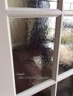 an image of a window that is covered in condens on the outside and inside