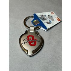 a keychain with the number 9 on it and a credit card attached to it