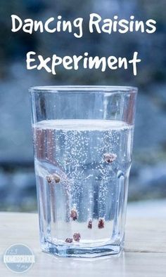 a glass filled with water sitting on top of a table