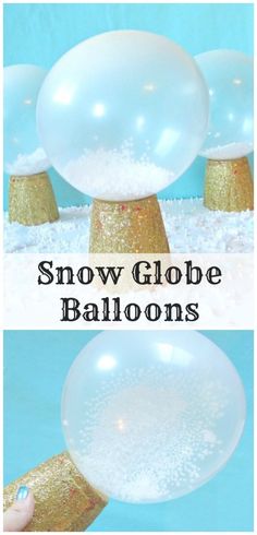 snow globe balloons are being held in the air